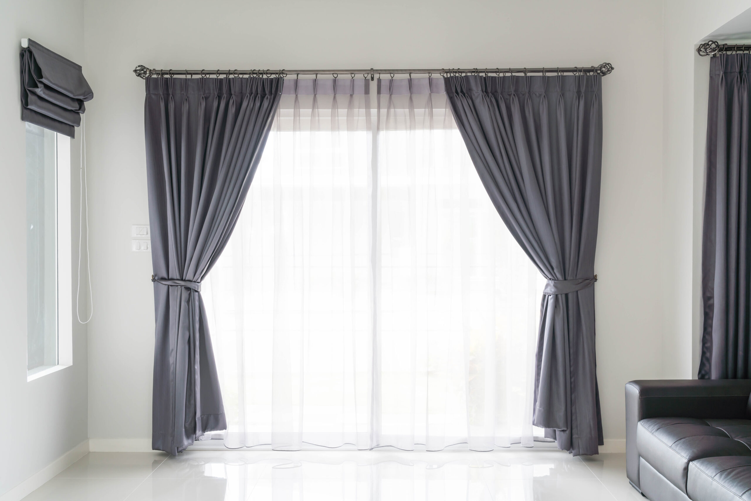 white room with black curtain